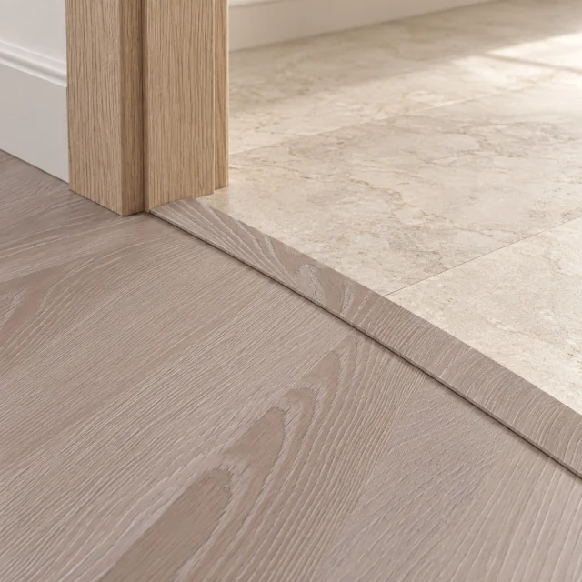 Aurora Chevron T-molding transition — installed view with product profile inset