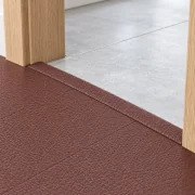 Chestnut T-molding transition — installed view