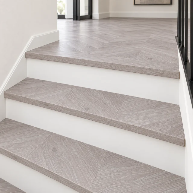 Clara Chevron stair nosing — installed view with product profile inset