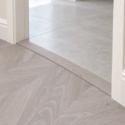 Clara Chevron T-molding transition — installed view