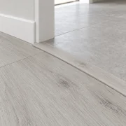 Como Oak White T-molding transition — installed view