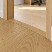 Forest T-molding transition — installed view