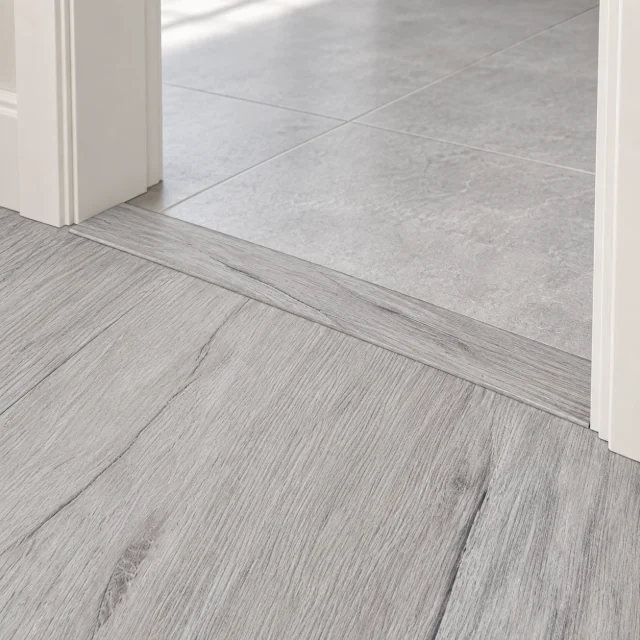 Light Grey Oak T-molding transition — installed view with product profile inset