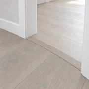 Nordic Oak T-molding transition — installed view