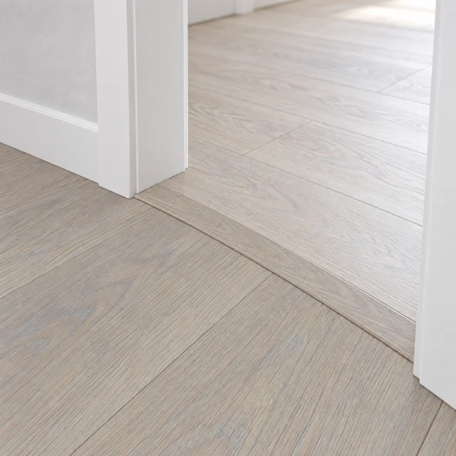 Nordic Oak T-molding transition — installed view with product profile inset