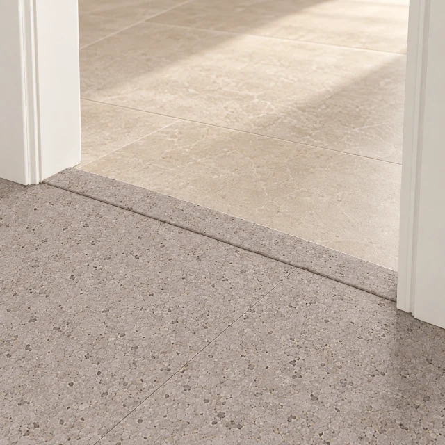 Terrazzo T-molding transition — installed view with product profile inset