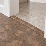 Walnut Burlwood T-molding transition — installed view