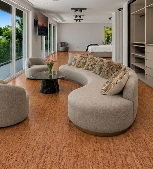 Modern luxury living space featuring Amber Streak 12mm cork flooring with a seamless natural cork appearance.