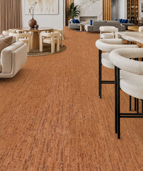 Contemporary luxury home featuring Amber Streak natural cork floating flooring with warm amber tones throughout the living room and kitchen.