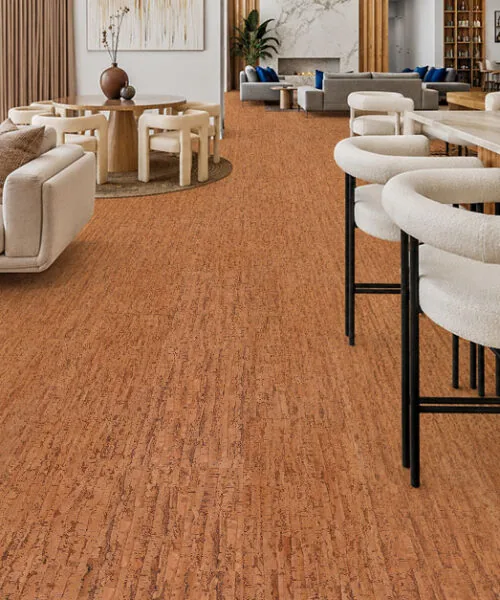 Contemporary luxury home featuring Amber Streak natural cork floating flooring with warm amber tones throughout the living room and kitchen.