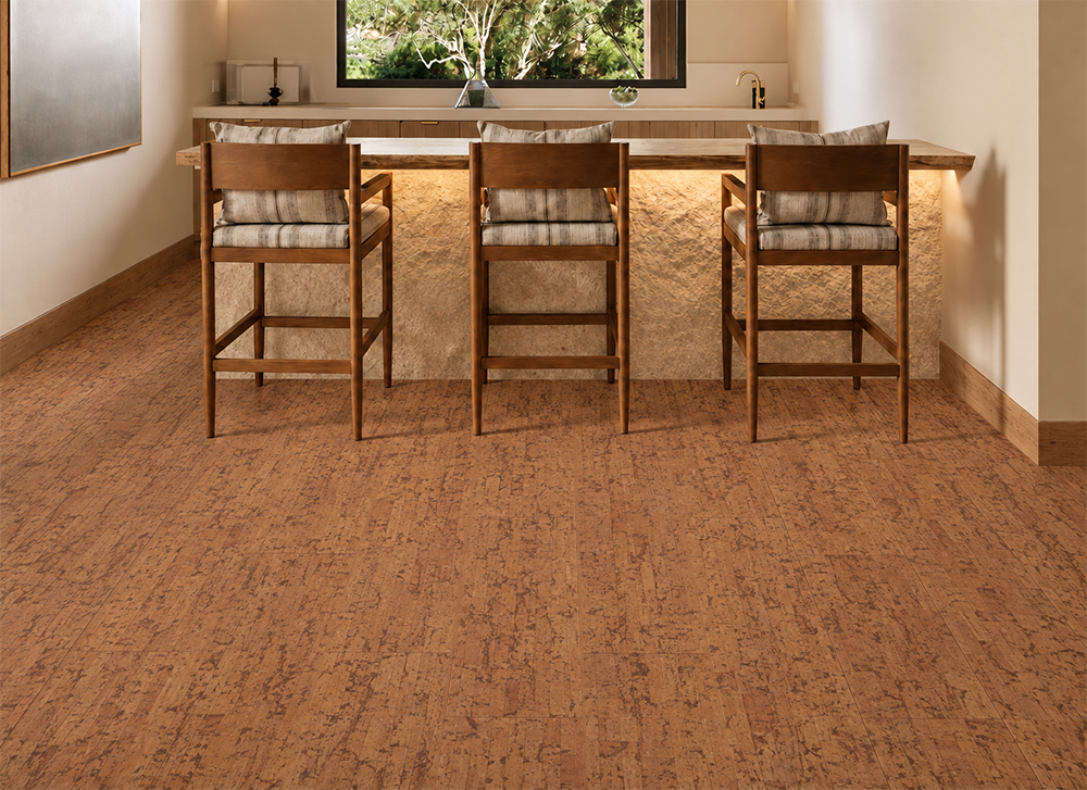 Amber Streak - 1/2" (12mm) - Cork Floating (FASt12) Medium-brown Amber Streak floating cork flooring covers a compact home bar with stone island and cushioned stools.