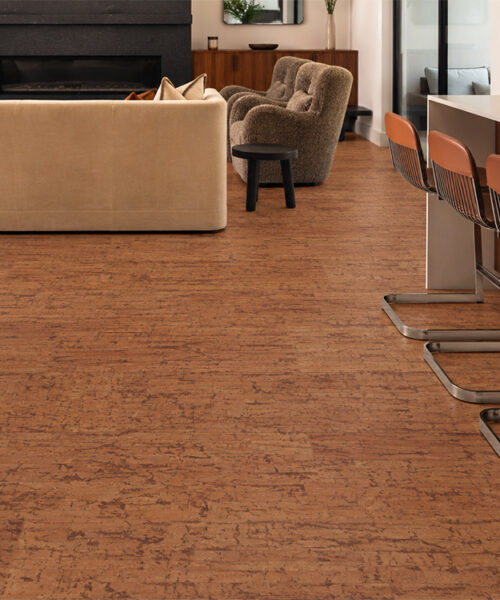Amber Streak - 1/2" (12mm) - Cork Floating (FASt12) Warm amber Amber Streak cork flooring flows between a kitchen bar and living room with fireplace.