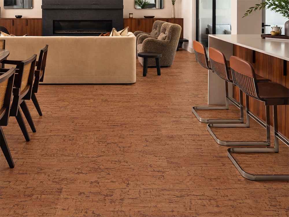 Amber Streak - 1/2" (12mm) - Cork Floating (FASt12) Warm amber Amber Streak cork flooring flows between a kitchen bar and living room with fireplace.