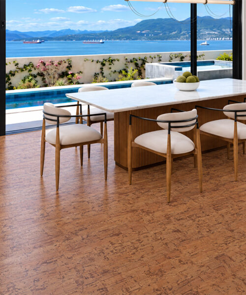 Amber Streak - 1/2" (12mm) - Cork Floating (FASt12) Sustainable Amber Streak cork flooring in warm brown complements a waterfront dining area with mountain views.