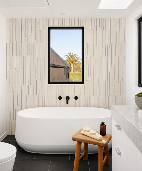 Sustainable Arctic Slate cork wall cladding behind bathtub, textured linear design for style and noise reduction