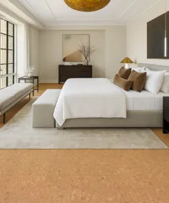 Modern bedroom with Autumn Leaves 12mm cork flooring, warm natural tones, and large windows providing bright daylight.