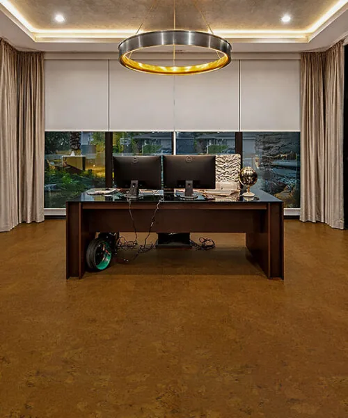 Autumn Ripple - 1/2" (12mm) - Cork Floating (FAR12) Autumn Ripple cork flooring in a modern home office with desk, glass walls, and ambient lighting