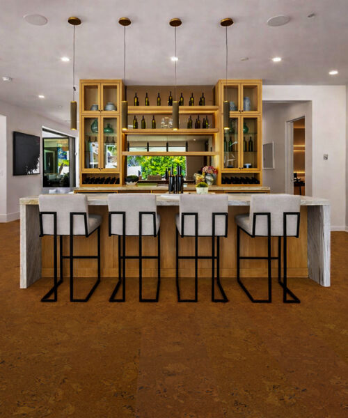 Autumn Ripple cork flooring in an open concept kitchen with island seating and modern cabinetry