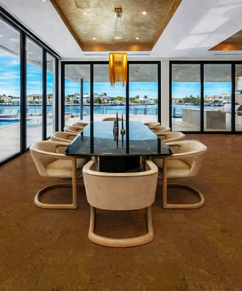 Autumn Ripple - 1/2" (12mm) - Cork Floating (FAR12) Autumn Ripple cork flooring in a dining room with large windows and waterfront views