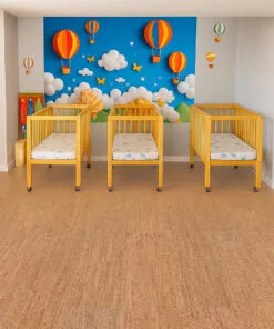 Natural Berber cork flooring in a bright nursery with yellow cribs and colorful hot air balloon wall—safe, non-toxic, and warm underfoot for babies