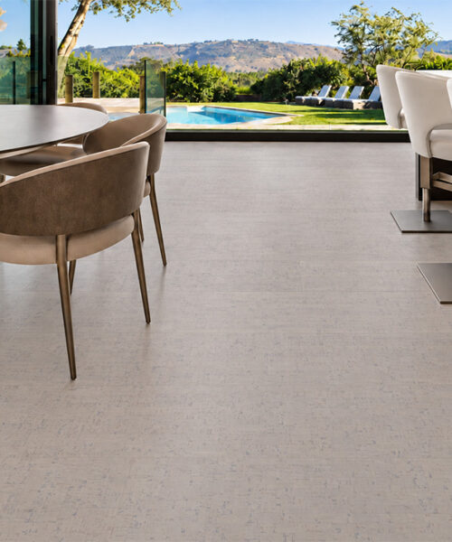 Bleached Birch 12mm floating cork flooring creates a light foundation for an open kitchen and dining area.