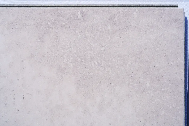 Bright Stone - 19/64" (7.5mm) - Swiss Techslate (MBrSt7.5) Bright Stone Swiss TechSlate flooring featuring a realistic gray slate stone appearance, durable natural cement fiberboard construction, waterproof floating floor system, and contemporary stone-look design.