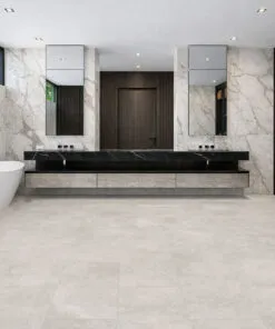Soft light stone flooring complementing a modern bathroom with clean architectural lines