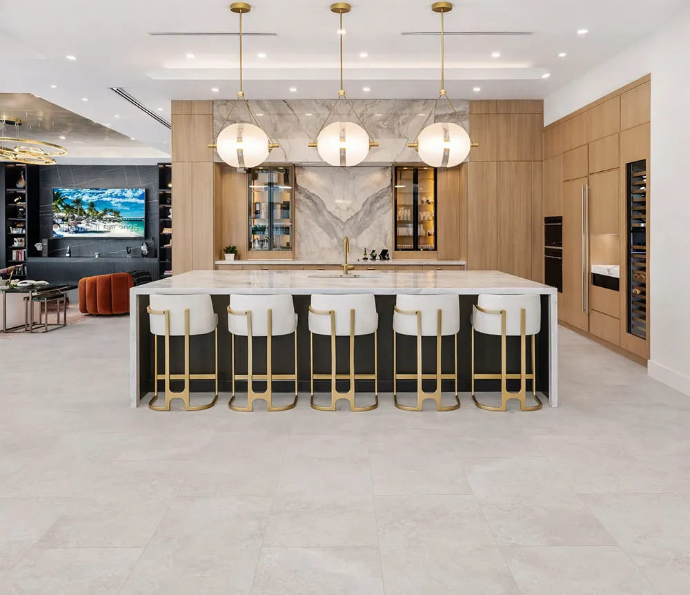 Bright Stone - 19/64" (7.5mm) - Swiss Techslate (MBrSt7.5) Neutral stone-look flooring enhancing a luxury kitchen with spacious island seating