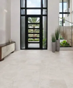 Light stone-look flooring creating a bright and welcoming modern entryway