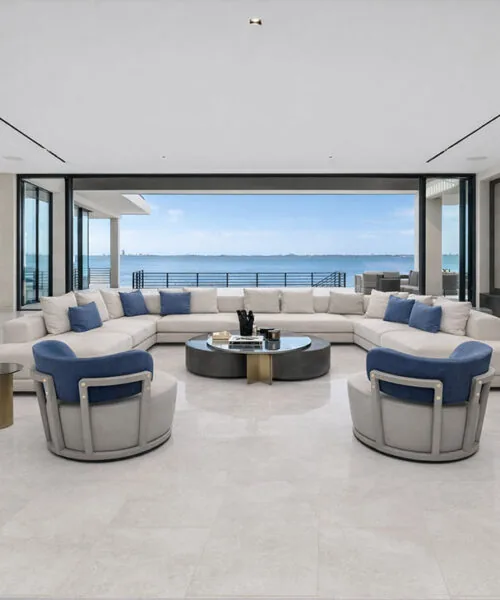 Bright Stone - 19/64" (7.5mm) - Swiss Techslate (MBrSt7.5) Open living room with expansive windows and light stone flooring throughout