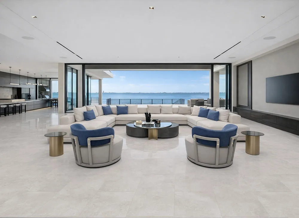 Bright Stone - 19/64" (7.5mm) - Swiss Techslate (MBrSt7.5) Open living room with expansive windows and light stone flooring throughout