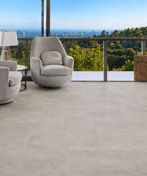 Bris Stone - 7/16" (11mm) - Swiss Design Cork Floating (FBsSt11) Light Bris Stone stone-look cork flooring creates a comfortable ocean-view lounge with two swivel chairs.