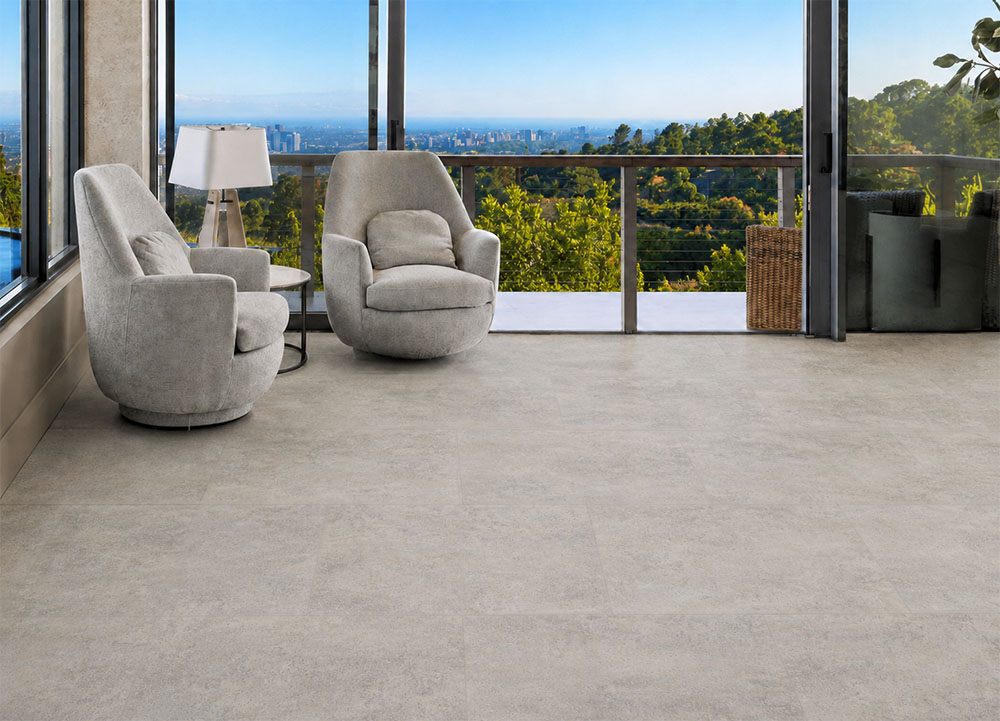 Bris Stone - 7/16" (11mm) - Swiss Design Cork Floating (FBsSt11) Light Bris Stone stone-look cork flooring creates a comfortable ocean-view lounge with two swivel chairs.