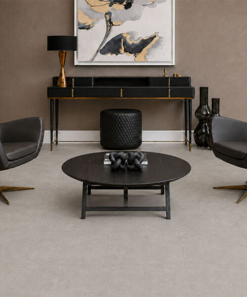 Bris Stone - 7/16" (11mm) - Swiss Design Cork Floating (FBsSt11) Matte Bris Stone cork floor planks in light gray frame black leather chairs and a console table.