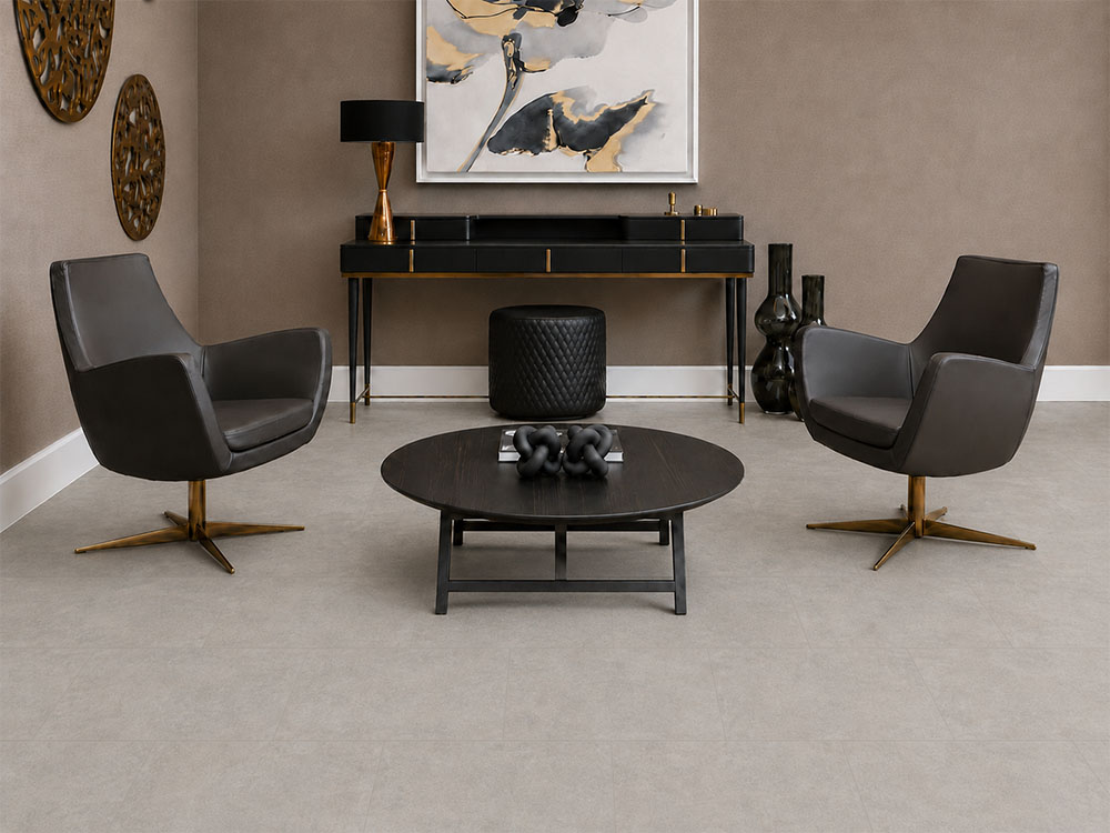 Bris Stone - 7/16" (11mm) - Swiss Design Cork Floating (FBsSt11) Matte Bris Stone cork floor planks in light gray frame black leather chairs and a console table.