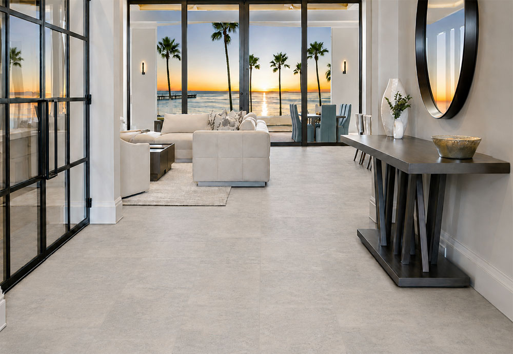 Bris Stone - 7/16" (11mm) - Swiss Design Cork Floating (FBsSt11) Bris Stone Swiss Design cork flooring in pale limestone tones leads toward a sunset-view living room.