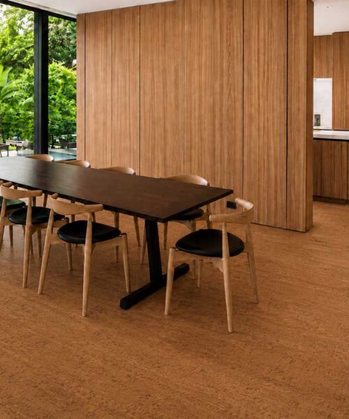 Cherry Line - 7/16" (11mm) - Swiss Real Cork Floating (FCHL11) Reddish-brown Cherry Line floating cork flooring with linear texture beneath a spacious dining table.