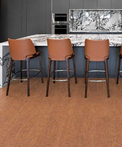 Cherry Line - 7/16" (11mm) - Swiss Real Cork Floating (FCHL11) Cherry Line Swiss cork flooring brings reddish-brown texture to a kitchen with marble counters and barstools.