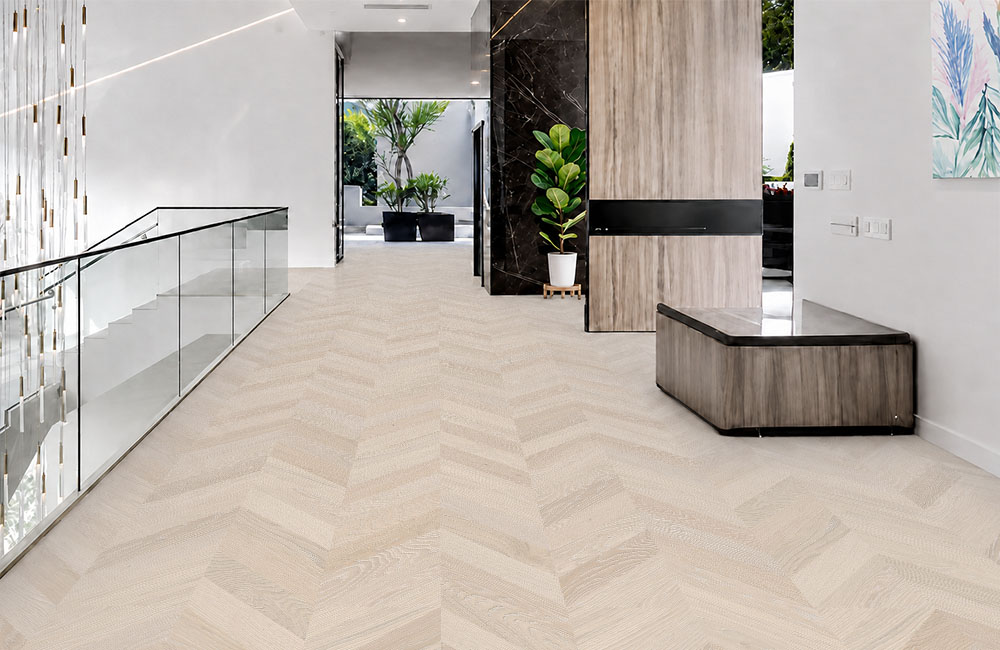 Clara Chevron - 7/16″ (11mm) – Swiss Design Cork Floating (FCla11) Light Clara Chevron cork floor planks form a soft chevron pattern across a contemporary upper-level hallway.