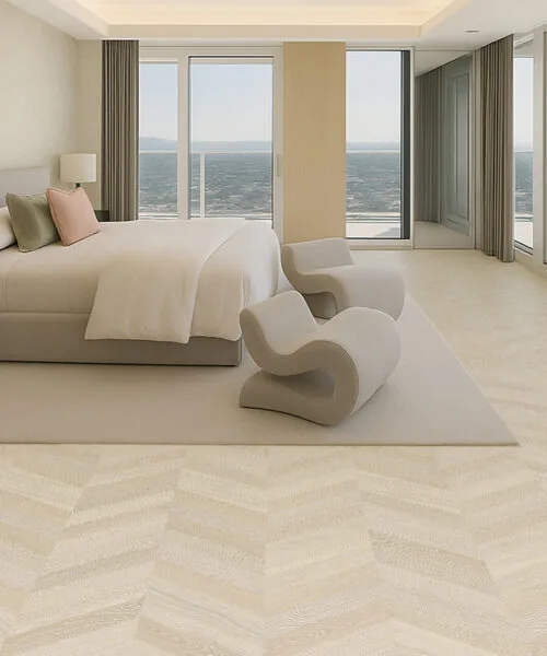 Clara Chevron - 7/16″ (11mm) – Swiss Design Cork Floating (FCla11) Spacious waterfront bedroom featuring soft-toned chevron cork flooring and minimalist décor.