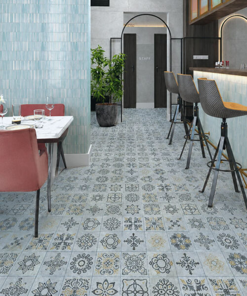 Classic Porcelain - 19/64" (7.5mm) - Swiss Techslate (MCPor7.5) Classic Porcelain Swiss TechSlate light gray mineral-based flooring with floral medallion patterns in a contemporary restaurant dining and bar area.