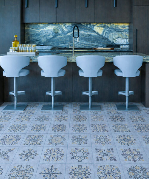 Classic Porcelain - 19/64" (7.5mm) - Swiss Techslate (MCPor7.5) Classic Porcelain Swiss TechSlate click-lock flooring in light gray with floral medallion prints across a modern kitchen with island seating.