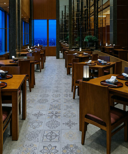 Classic Porcelain - 19/64" (7.5mm) - Swiss Techslate (MCPor7.5) Classic Porcelain Swiss TechSlate commercial-grade flooring in light gray with repeating floral and medallion designs in a restaurant dining room.