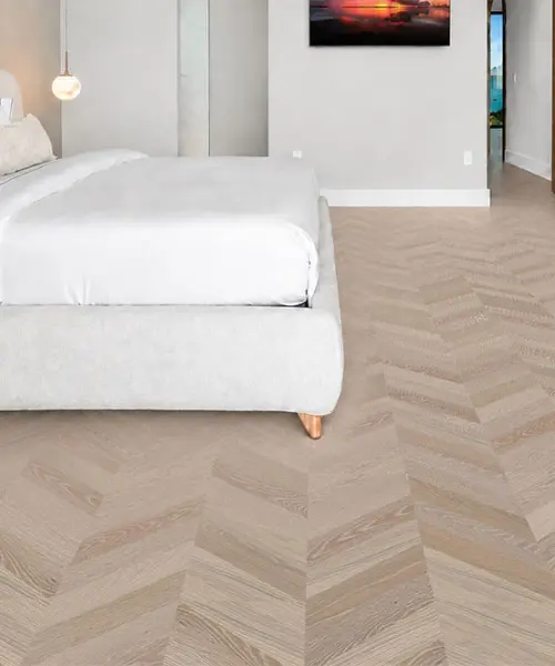 Aurora Chevron - 7/16″ (11mm) - Swiss Design Cork Floating (FAuro11) Aurora Chevron installed flooring in a furnished daylight interior; reviewed room view (FAuro11)