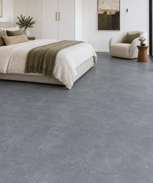 Concrete Alloy installed flooring in a furnished daylight interior; accurate product scale visualization (MConA7.5)