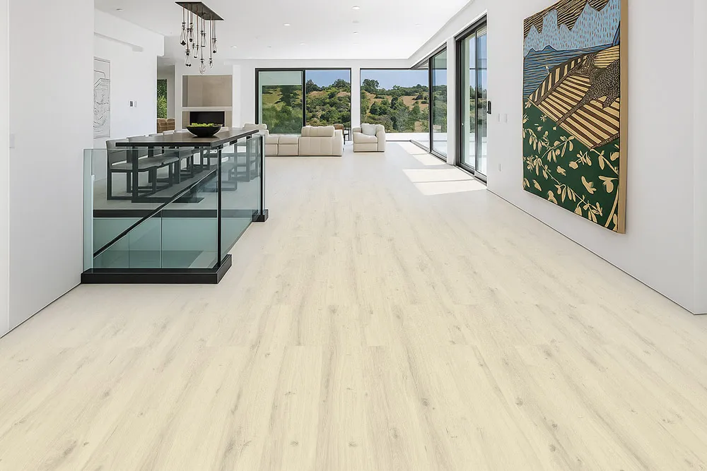 Como Oak White - 7/16" (11mm) - Swiss Design Cork Floating (FCOW11) Open-concept living area in a contemporary home with bright natural light and Como Oak White Swiss Cork Design Floating Flooring