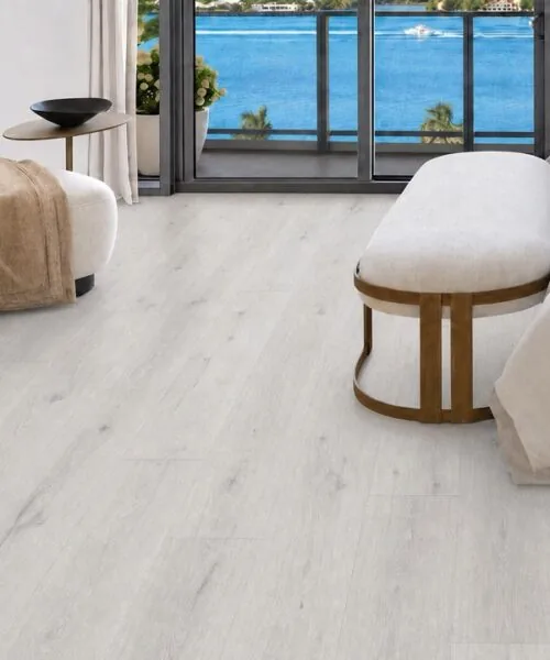 Como Oak White - 7/16" (11mm) - Swiss Design Cork Floating (FCOW11) Light Como Oak cork flooring in a bright bedroom overlooking the coast