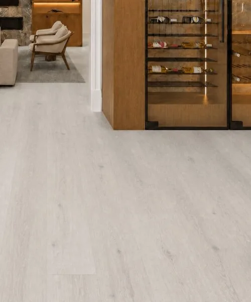 Como Oak White - 7/16" (11mm) - Swiss Design Cork Floating (FCOW11) Wide-plank Como White Oak cork floor in a hallway with wine storage