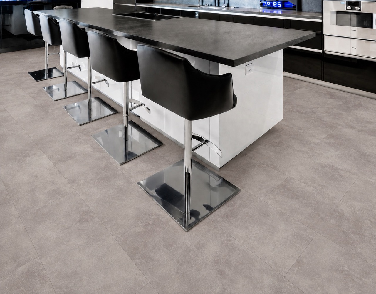 Copperstone Gray - 3/8" (9.5mm) - Forna Natural Composite Flooring with Waterproof Hydrowood Core (NCopG9.5) Copperstone Gray waterproof floating flooring adds a refined concrete-look finish to a modern kitchen with island seating.