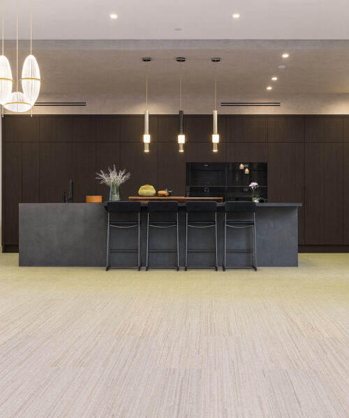 Vertical - 7/16" (11mm) - Swiss Real Cork Floating (FVtc11) Sophisticated kitchen with black cabinetry, pendant lighting, and Vertical Swiss cork flooring providing warmth, comfort, and a refined modern look.”